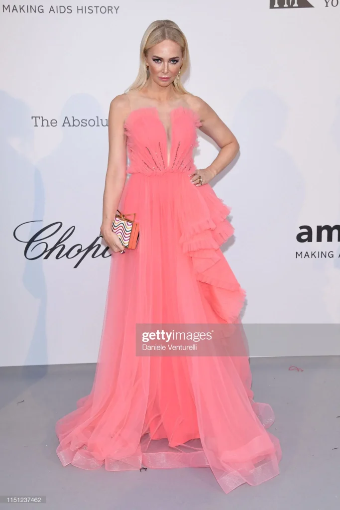 Amanda Cronin shining in our coral dress at the AMFAR party during the Cannes Film Festival.