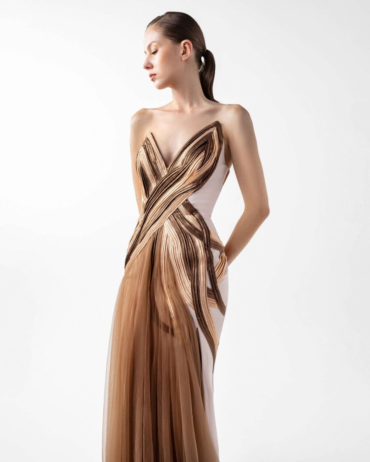 Strapless Nude Crepe Gown with Angular Bronze metallic Folds and Tulle Cascade