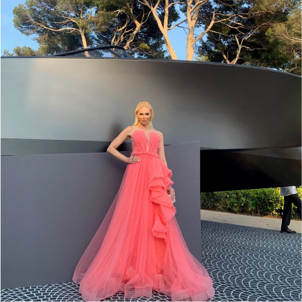 Amanda Cronin shining in our coral dress at the AMFAR party during the Cannes Film Festival.